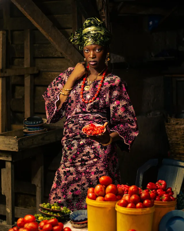 A woman selling peppers at a traditional market in Lagos, Nigeria.